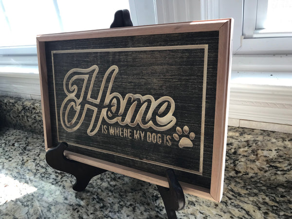 Home is where my dog is carved in wood
