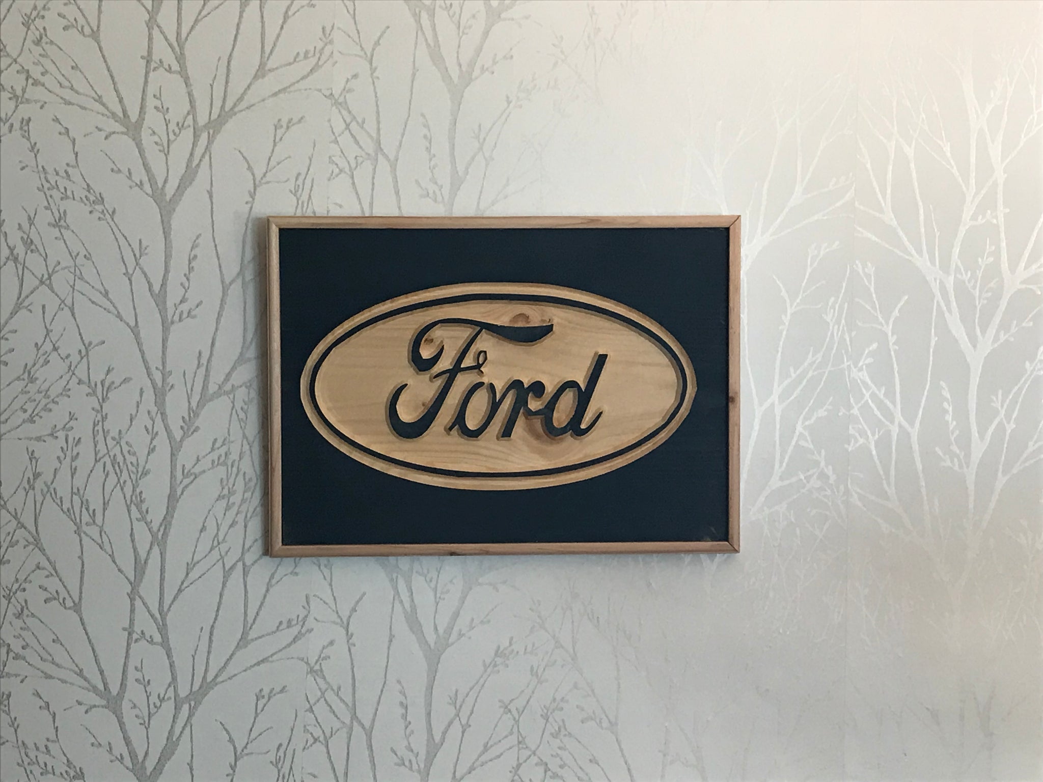 Ford logo carved in wood
